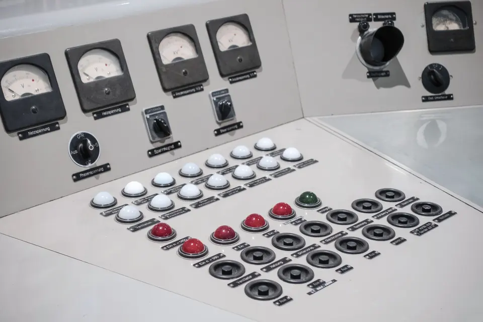 A control panel with several buttons and gauges